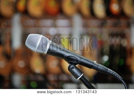 Microphone against the background of music shop