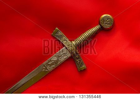 element of the ancient dagger handle on a red background