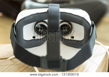 Sofia Bulgaria - May 13 2016: Virtual reality (VR) headsets (glasses) from behind. VR is immersive multimedia or computer-simulated reality - a computer technology that replicates an environment and simulates a user's physical presence and environment to 