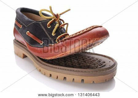 torn shoe on a white background isolate. close-up