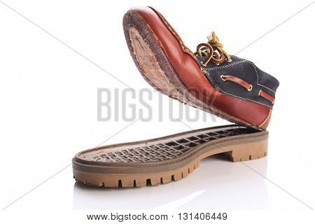 torn shoe on a white background isolate. close-up