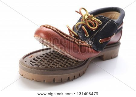 torn shoe on a white background isolate. close-up