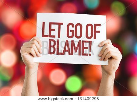 Let Go Of Blame placard with bokeh background