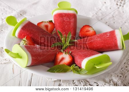 Tasty Strawberry Sorbet With Mint On A Stick Close Up. Horizontal