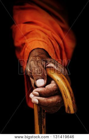 Hand sadhu in Nepal, holding a cane