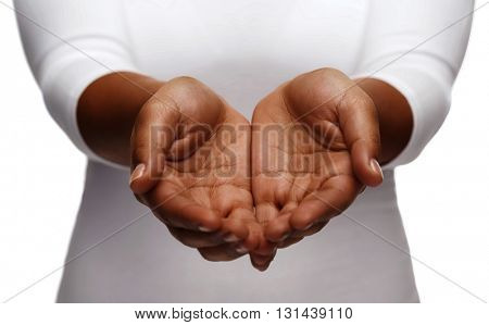 people, charity and poverty concept - close up of african american female empty cupped hands holding and showing something