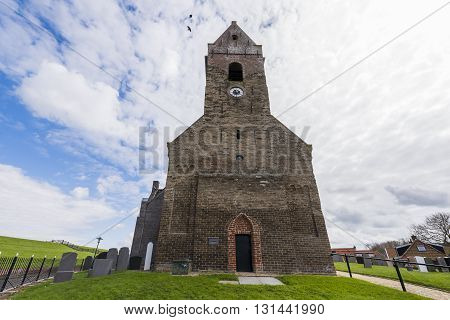Wierum The Netherlands - April 18 2016: Church tower of the small city of Wierum in Friesland in the Netherlands.