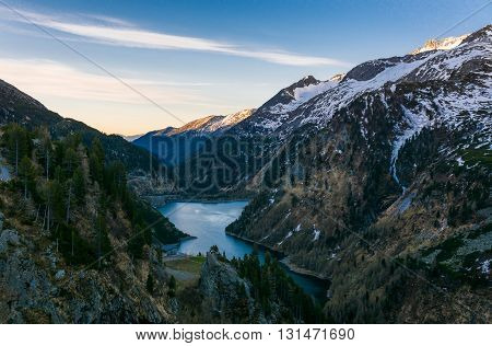 Mountain lake at dusk. Malta valley in Austria.