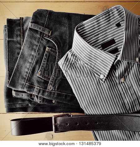 Man items flat on wood background monochrome