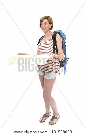 young attractive American tourist woman with red hair holding city map carrying backpacker rucksack and wearing shorts smiling happy isolated on white background in travel and vacation concept