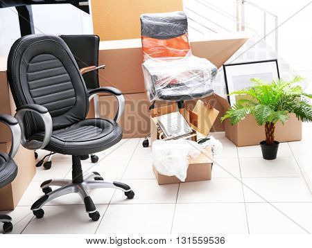 Move concept. Unpacking cardboard boxes in a new office