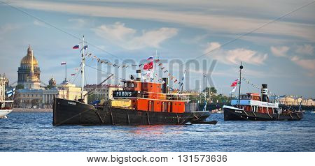 SAINT-PETERSBURG, RUSSIA - MAY 28, 2011: Finnish retro steamers Puhois and Hurma in the waters of Neva river in Saint-Petersburg