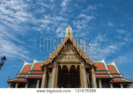 Top of the temple of Emerald Buddha inside the Grand Palace of Bangkok. Architectures inside the Palace, especially the temples are amazing. Moreover, the clear, blue sky charms the beauty more.
