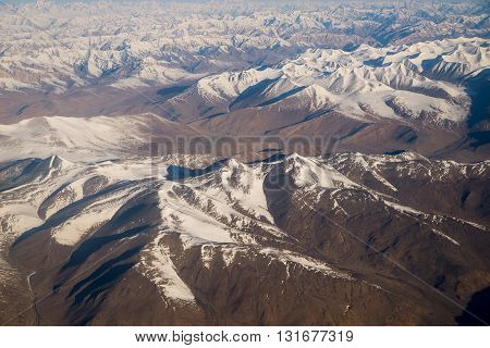 Snow mountains range near Himalaya in Ladakh, India (view from airplane)