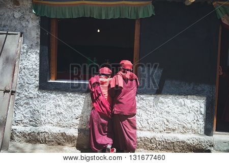 LADAKH, INDIA - MAY 1, 2016: Monks in Hemis monastery in Ladakh, Kashmir, India. Ladakh is sparsely populated regions in Jammu and Kashmir and its culture and history are related to that of Tibet.