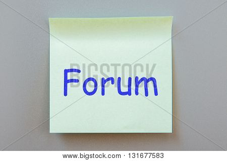 Adhesive note with inscription on a label. Front view