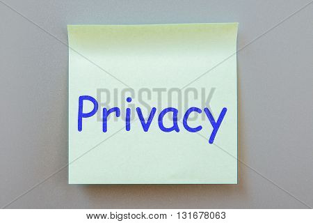 Adhesive note with inscription on a label. Front view
