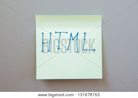 Adhesive note with inscription on a label. Front view