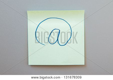 Adhesive note with inscription on a label. Front view