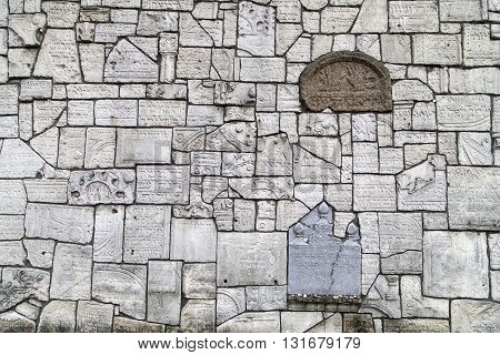 Wailing Wall at Remuh Cemetery built with fragments of Jewish tombstones , Krakow ,Poland.