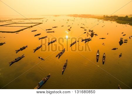 Boats in Tam Giang lagoon in sunrise from drone.Hue, Vietnam