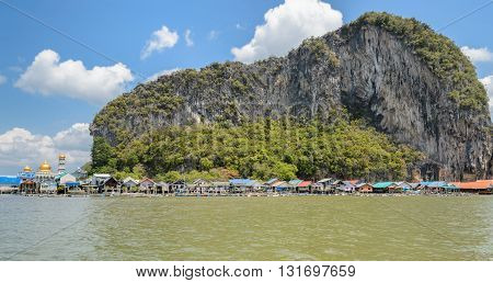 Landscape of limestone karsts of Phang Nga Bay National Park. Panyi island or Koh Panyee floating fishing village in Phang Nga Province Thailand