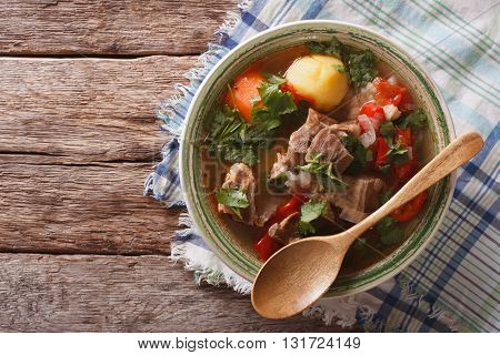 Shurpa Lamb Soup With Vegetables Closeup At The Plate. Horizontal Top View