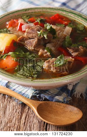Lamb Soup With Vegetables Closeup On The Table. Vertical