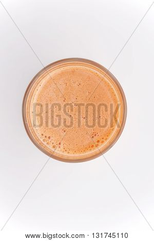 Fresh carrot juice glass isolated on white background.