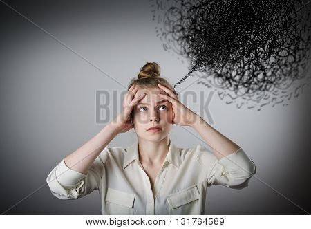 Young slim woman and chaos in mind. Young slim woman suffering from headache.