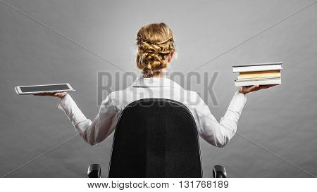 Woman Holding Traditional Book And E-book Reader
