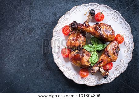 Plate with chicken meat on rustic background