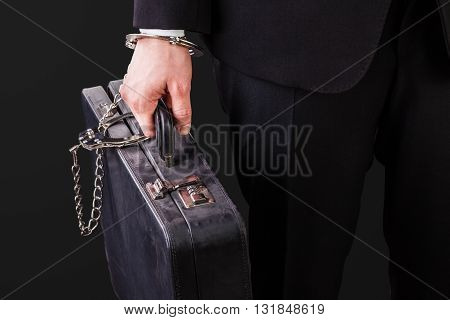 Old Suitcase Secured With Handcuffs