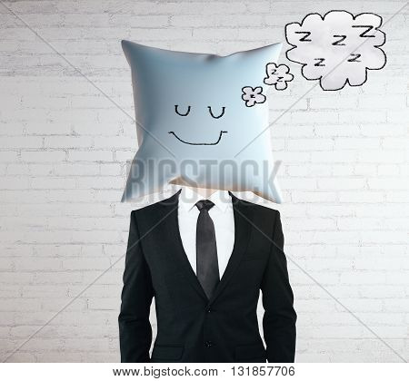 Sleeping businessman with smiley on pillow instead of head