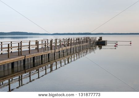 Wooded bridge in the port. Lithuania Plateliai