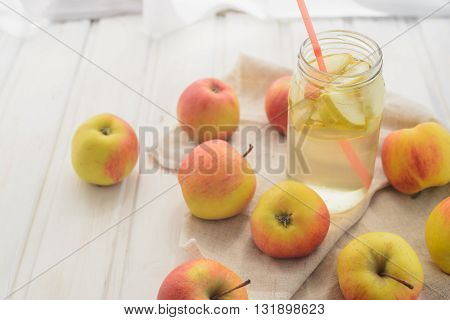 fresh rustic concept, apples on a white rag on the wooden background
