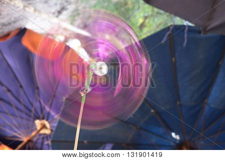 moving pinwheel with umbrella beach at Thailand