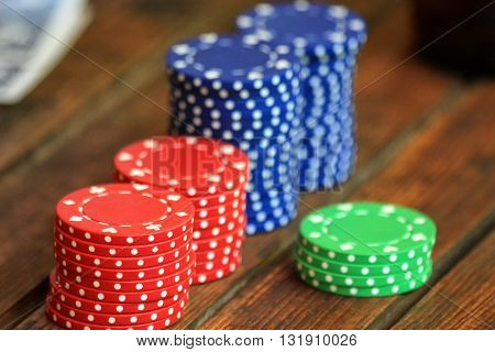 Red, blue, green chips for poker on the table