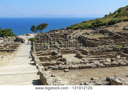 The ruins of the ancient acropolis on a background of a sea landscape on the island of Rhodes in Greece.