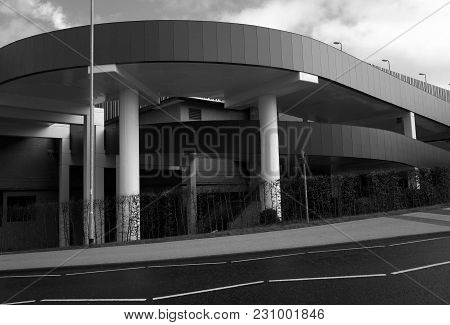Bracknell, England - March 04, 2018: Black And White Image Of The Concrete Ramp Entrance To One Of T