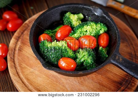 Broccoli Cooked With Cherry Tomatoes Inside A Frying Pan