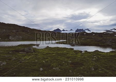Small Pond, Mountains And Nature In Norway National Park