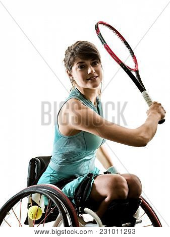 one caucasian young ped tennis player woman in welchair sport tudio in silhouette isolated on white background