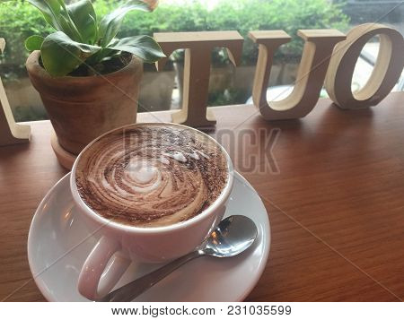 Mocca Coffee On White Wooden Table And Back Text 