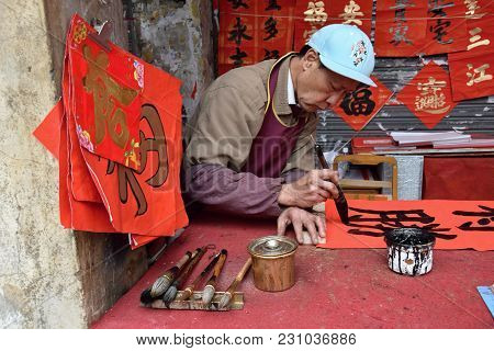 Foshan, China - Circa February 2018: An Old Man Writing Blessing Couplets At The Occasion Of Spring 