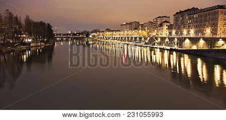 Po River Flowing In Torino City, Italy, Night View On Murazzi Docks