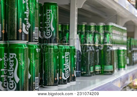 Moscow, Russia - March 12, 2018: Display with Carlsberg beer in cans in supermarket Lenta. One of largest retailer in Russia
