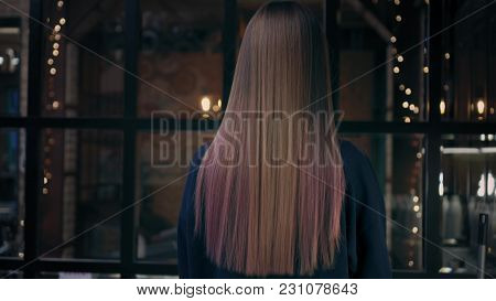 Lovely Young Woman Turns To The Camera, Smiles And Plays With Her Long Colorful Hair In Beauty Salon