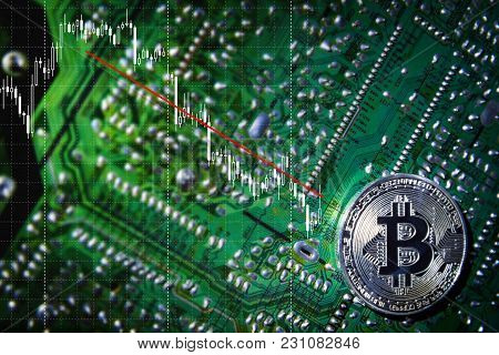 Silver Bitcoins On The Chip. Trend Down. The Green Background. Crypt Of Safety. Virtual Money. Minin