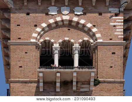 VERONA, ITALY - MAY 27: Torre dei Lamberti - medieval tower of the Lamberti XI century - 84 m. Piazza delle Erbe, UNESCO world heritage site  in Verona, Italy, on May 27, 2017.